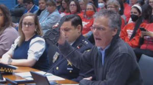 TCS Cook County Sheriff Tom Dart holds up an expanded magazine during a House hearing Tuesday